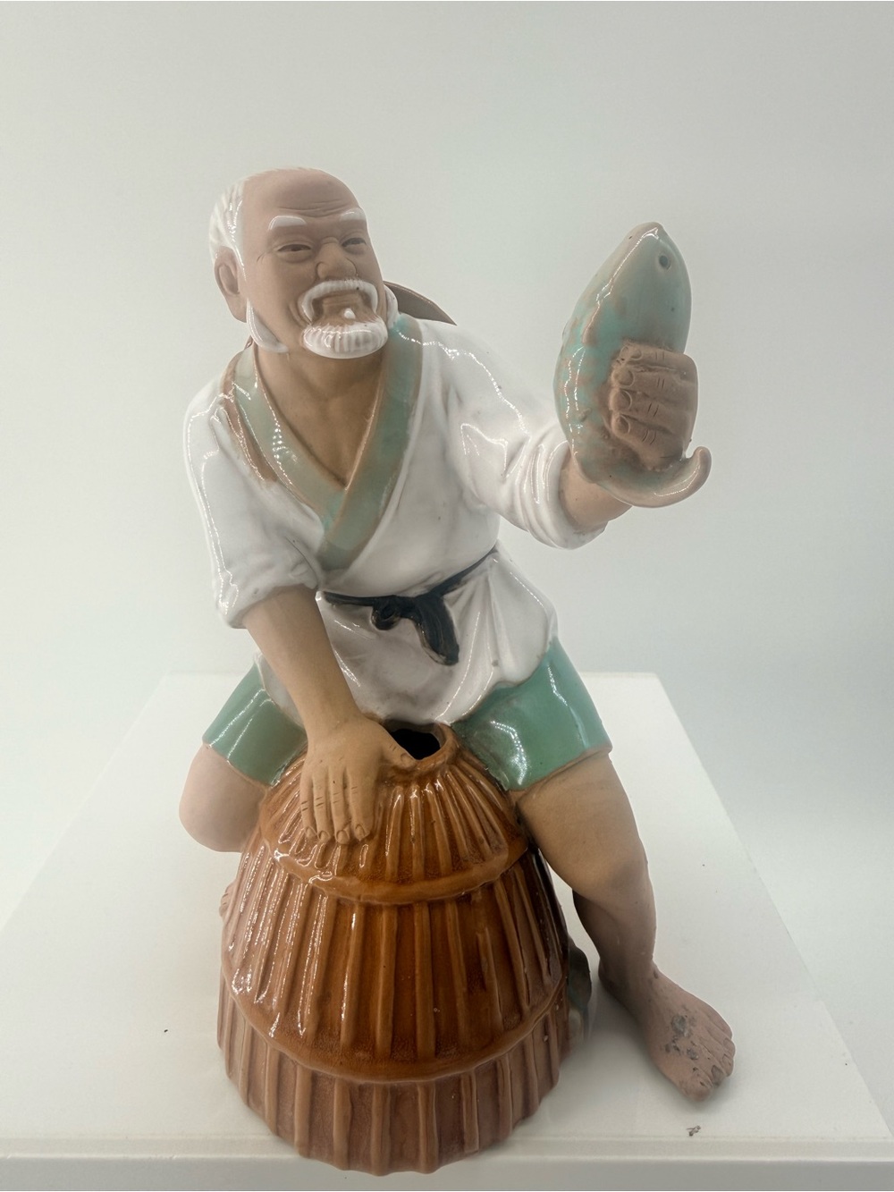 Hand-Painted Ceramic Fisherman Figurine in White and Mint Green